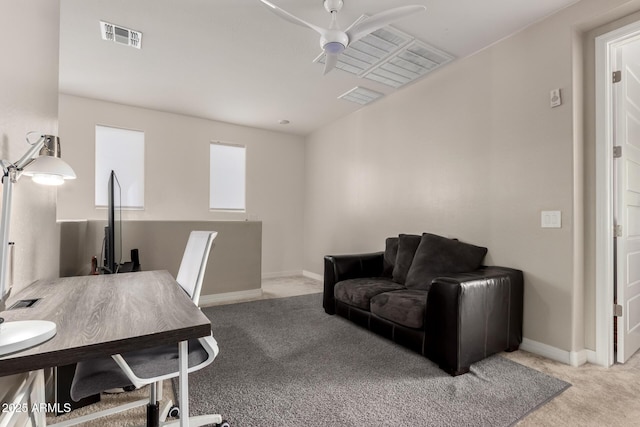 office area with light carpet and ceiling fan