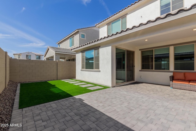 back of house with a patio