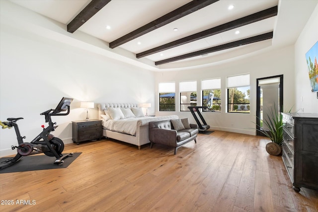 bedroom featuring light wood-type flooring, baseboards, beam ceiling, and recessed lighting