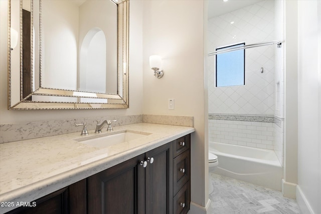 bathroom featuring baseboards, shower / bath combination, vanity, and toilet