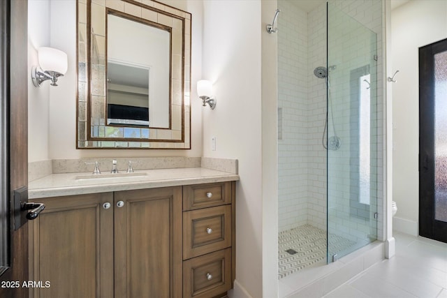 full bathroom featuring toilet, a stall shower, tile patterned flooring, and vanity