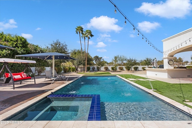 view of swimming pool featuring a patio area and a pool with connected hot tub