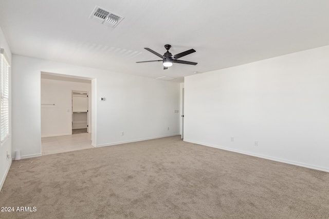 spare room with light carpet and ceiling fan