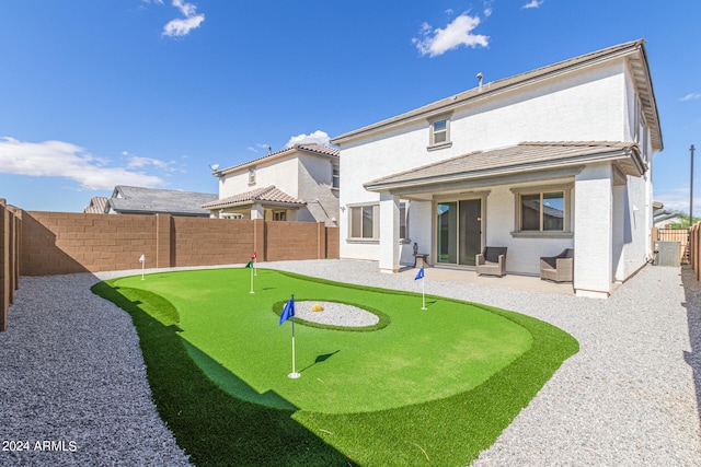 back of house with a patio area