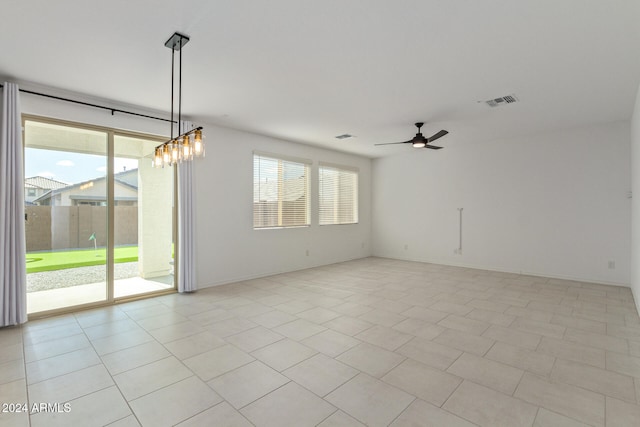 tiled empty room with ceiling fan