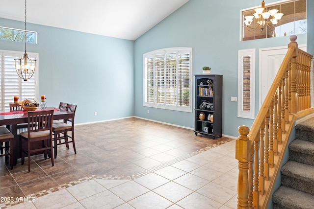 dining room with tile patterned floors, a notable chandelier, and baseboards