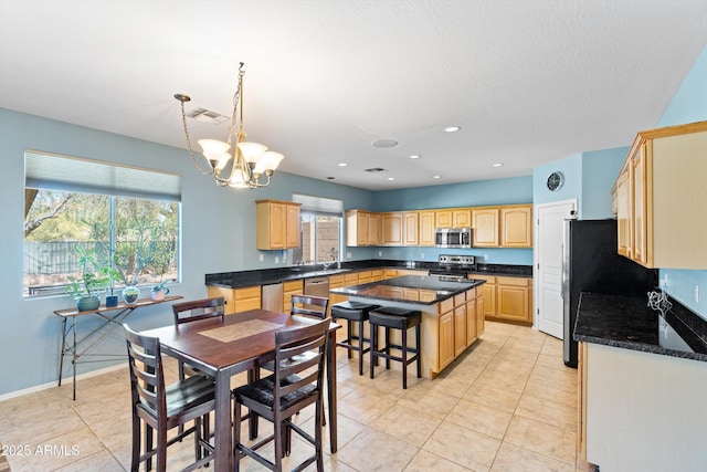 dining space featuring light tile patterned floors, visible vents, an inviting chandelier, and recessed lighting