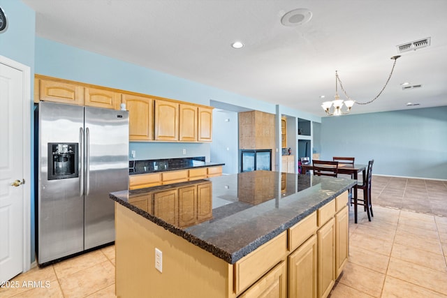 kitchen with visible vents, light brown cabinets, an inviting chandelier, and stainless steel fridge with ice dispenser