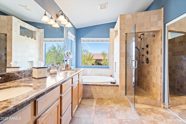 bathroom featuring a garden tub, a stall shower, lofted ceiling, and a sink