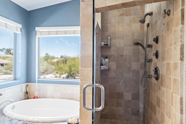 bathroom featuring a garden tub and a stall shower