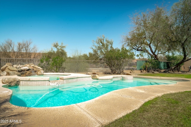 view of pool with a fenced in pool, an in ground hot tub, and fence