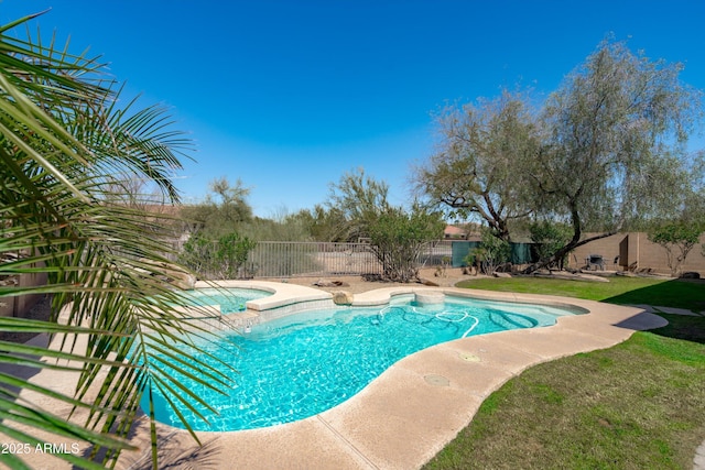 view of swimming pool with a fenced in pool, an in ground hot tub, a lawn, and a fenced backyard