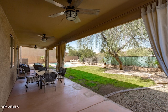 view of patio / terrace with a fenced in pool, outdoor dining area, and a fenced backyard