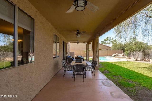 view of patio with a fenced in pool, a fenced backyard, and outdoor dining space