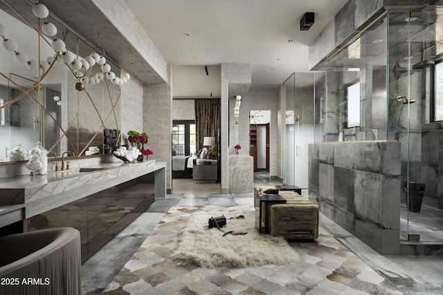 full bath with a stall shower and vanity