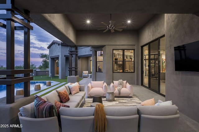 view of patio featuring an outdoor pool, ceiling fan, and an outdoor hangout area