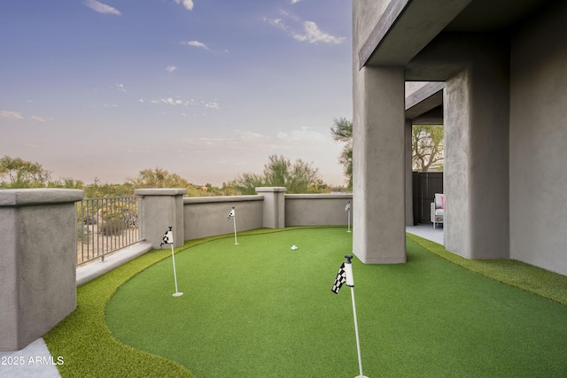 view of yard at dusk