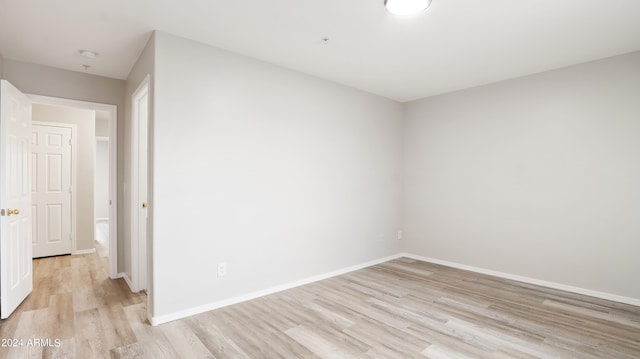 unfurnished room featuring light hardwood / wood-style flooring