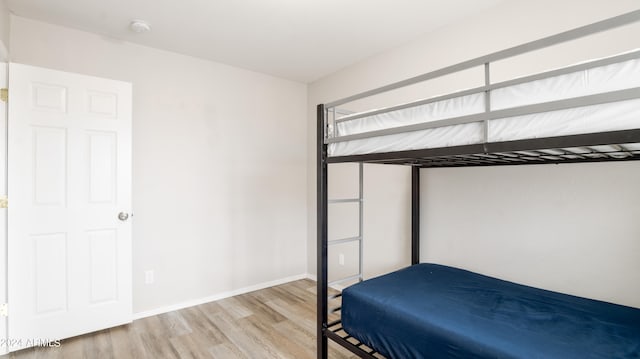 bedroom with light wood-type flooring