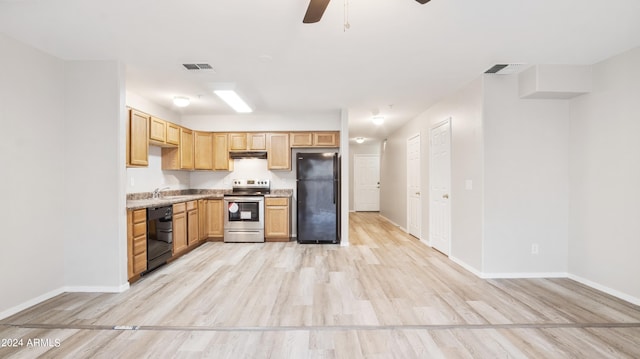 kitchen featuring light hardwood / wood-style floors, ceiling fan, black appliances, light stone countertops, and sink