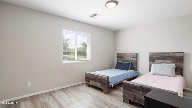 bedroom featuring light wood-type flooring