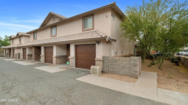 view of front of property with a garage