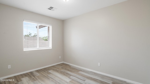 spare room featuring light wood-type flooring