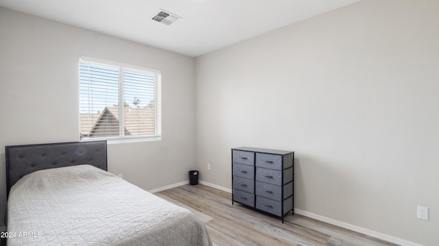 bedroom with light hardwood / wood-style flooring