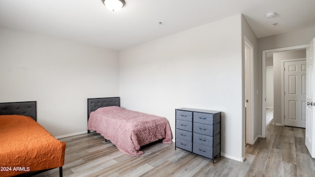 bedroom with hardwood / wood-style floors