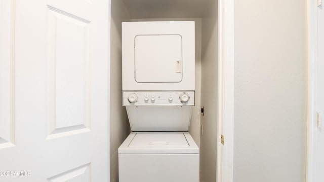 laundry area with stacked washer / dryer