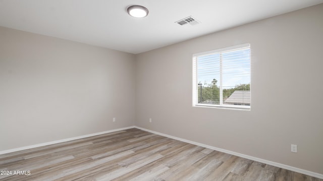 spare room featuring light hardwood / wood-style floors