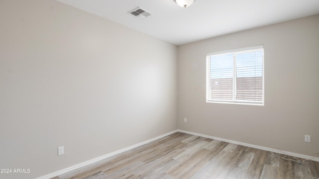 unfurnished room with light hardwood / wood-style flooring