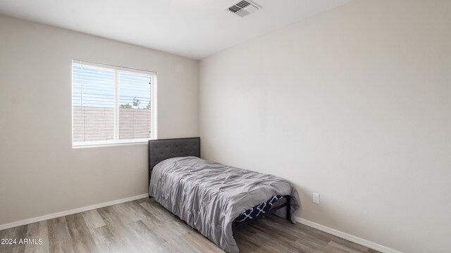 bedroom with light hardwood / wood-style flooring