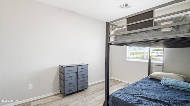 bedroom with light hardwood / wood-style flooring