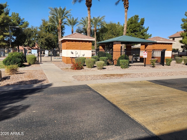 surrounding community featuring a gate and fence