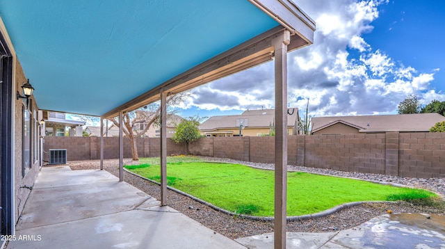 view of yard with a patio area, a fenced backyard, and central air condition unit