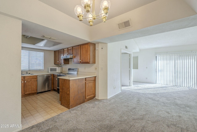 kitchen with electric stove, open floor plan, decorative light fixtures, light countertops, and stainless steel dishwasher