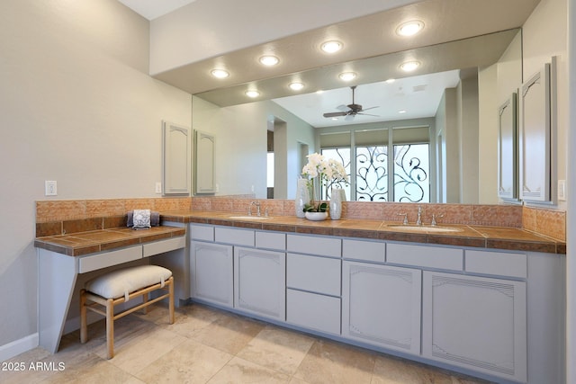 bathroom featuring ceiling fan and vanity