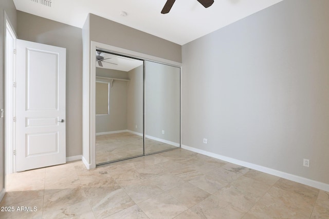 unfurnished bedroom with a closet and ceiling fan