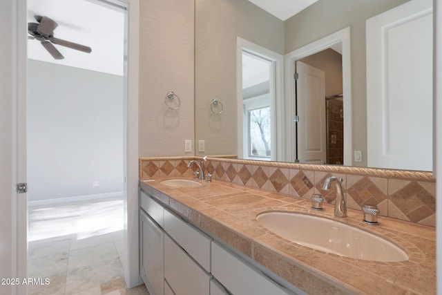 bathroom with ceiling fan and vanity