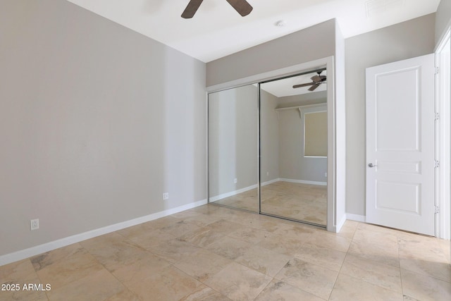 unfurnished bedroom with a closet and ceiling fan