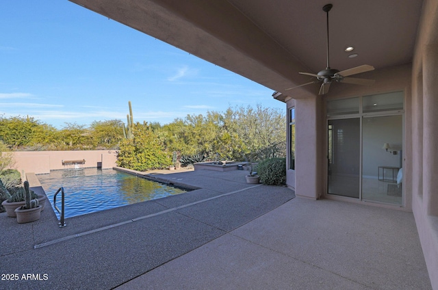 view of swimming pool with ceiling fan and a patio