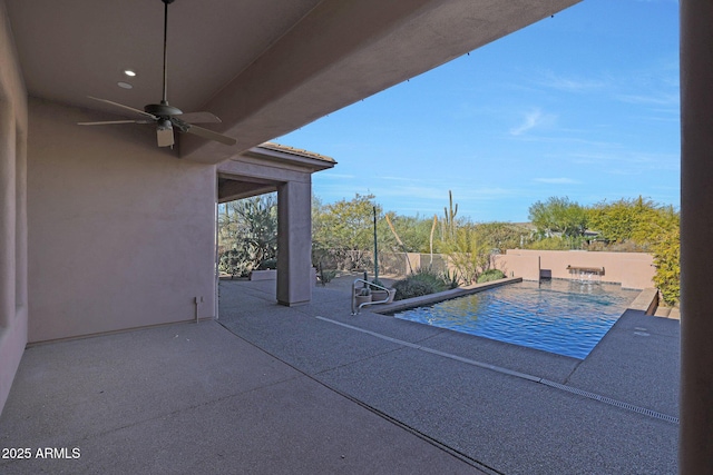 view of pool featuring ceiling fan and a patio area