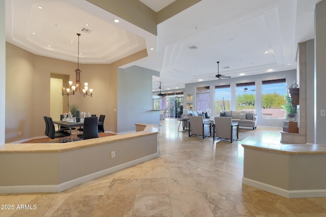 reception with ceiling fan with notable chandelier