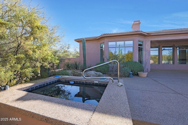 view of swimming pool with a patio