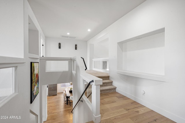 stairway with wood-type flooring