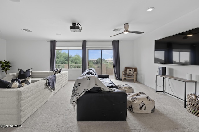 carpeted living room featuring ceiling fan