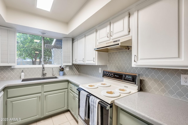 kitchen with under cabinet range hood, a sink, white cabinetry, white range with electric stovetop, and light countertops