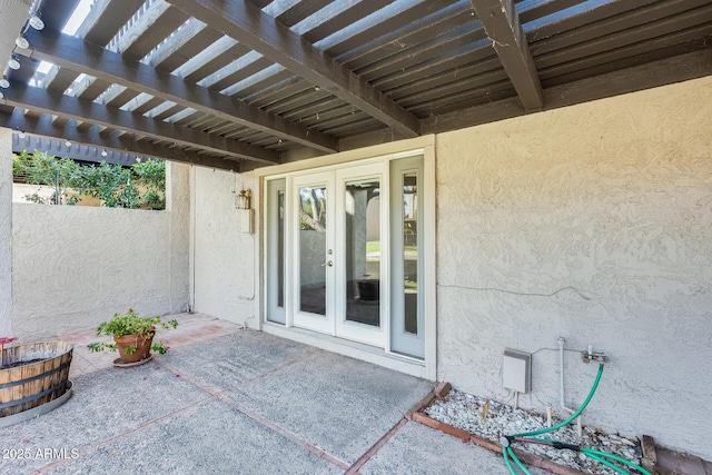 view of patio featuring french doors and a pergola