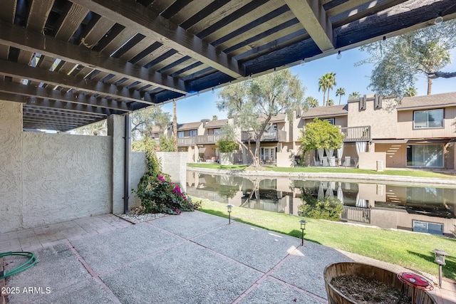 view of patio featuring a residential view and a pergola